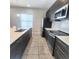Modern kitchen featuring stainless steel appliances, sleek cabinetry, quartz countertop and a subway tile backsplash at 191 Aidans Lndg, Haines City, FL 33844