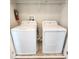 Laundry room featuring a white washer and dryer at 191 Aidans Lndg, Haines City, FL 33844