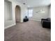 Spacious lounge with decorative mirror, media center and comfy couch at 191 Aidans Lndg, Haines City, FL 33844
