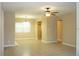 Bright and open-concept living room featuring tile floors and neutral colors at 2005 Kingsland Ave, Orlando, FL 32808