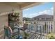 Charming balcony with cozy seating and garden decor offering a peaceful outdoor retreat with views of nearby buildings at 2151 Valencia Blossom St, Clermont, FL 34711