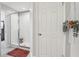 Clean bathroom with a tiled shower, glass door, and convenient access to the bedroom at 2151 Valencia Blossom St, Clermont, FL 34711