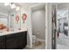 Well-lit bathroom featuring a vanity and a separate toilet room, providing convenience and privacy at 2151 Valencia Blossom St, Clermont, FL 34711