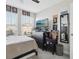 Well-lit bedroom featuring a TV, dresser, and comfortable furnishings, creating a relaxing retreat at 2151 Valencia Blossom St, Clermont, FL 34711