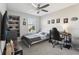 Inviting bedroom featuring a gaming setup, desk, ceiling fan, and ample natural light at 2151 Valencia Blossom St, Clermont, FL 34711