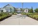 Exterior of clubhouse with well-kept landscaping and easy pedestrian access at 2151 Valencia Blossom St, Clermont, FL 34711