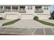 Townhome exterior featuring private balconies, driveways, and individual one-car garages at 2151 Valencia Blossom St, Clermont, FL 34711