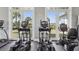Community gym featuring elliptical machines, rubber flooring, and large windows at 2151 Valencia Blossom St, Clermont, FL 34711