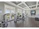 Community gym with modern weight-training machines, television, and large windows at 2151 Valencia Blossom St, Clermont, FL 34711