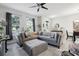 Comfortable living room with large windows providing natural light and neighborhood views at 2151 Valencia Blossom St, Clermont, FL 34711