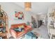 Stylish living room with comfortable seating, decorative elements, and a view of the staircase at 2151 Valencia Blossom St, Clermont, FL 34711