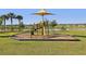 Community playground featuring climbing structure, slide, and shaded seating in a Gathering-friendly neighborhood at 2151 Valencia Blossom St, Clermont, FL 34711