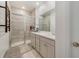 Modern bathroom with double vanity, tiled walk-in shower, and contemporary fixtures at 2224 Celebration Blvd, Celebration, FL 34747