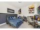 Bedroom with a plaid bedspread, a black bed frame, and decor at 2224 Celebration Blvd, Celebration, FL 34747