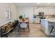 Open dining area connected to a modern kitchen with a view of the backyard at 2224 Celebration Blvd, Celebration, FL 34747