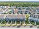 Charming two-story townhouse featuring a well-manicured lawn and inviting front porch, perfect for relaxation and curb appeal at 2224 Celebration Blvd, Celebration, FL 34747