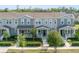 Charming townhome with a well-maintained lawn and inviting front porch at 2224 Celebration Blvd, Celebration, FL 34747