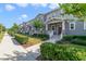 Street view of attractive townhomes featuring landscaped yards and inviting covered entries at 2224 Celebration Blvd, Celebration, FL 34747
