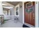 Inviting front porch with decorative wreath and charming details on a well-maintained townhome at 2224 Celebration Blvd, Celebration, FL 34747
