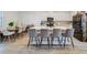 Modern kitchen with granite island, stainless steel appliances and dining area at 2224 Celebration Blvd, Celebration, FL 34747