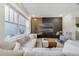 Inviting living space with stylish decor, large windows, and comfortable sectional sofa at 2224 Celebration Blvd, Celebration, FL 34747