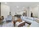 Open-concept living room featuring modern decor, comfortable seating, and a welcoming atmosphere at 2224 Celebration Blvd, Celebration, FL 34747