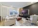 Spacious living room with large sectional sofa, modern media center, and stylish decor at 2224 Celebration Blvd, Celebration, FL 34747