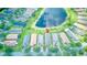 Drone shot of a neighborhood centered around a small pond with fountain in center at 233 Rialto Rd, Kissimmee, FL 34759