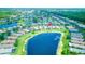 Aerial shot showcasing the home's serene lakefront location and the community's lush green spaces at 233 Rialto Rd, Kissimmee, FL 34759