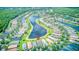 Aerial view of homes and surrounding community including a large lake at 233 Rialto Rd, Kissimmee, FL 34759