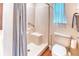 Bathroom with a step-in shower and a toilet at 233 Rialto Rd, Kissimmee, FL 34759