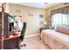 Bedroom featuring cozy carpet, a desk and a bed at 233 Rialto Rd, Kissimmee, FL 34759
