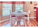 Bright dining nook with a table, chairs and a large window offering natural light at 233 Rialto Rd, Kissimmee, FL 34759
