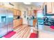 Well-lit kitchen with stainless appliances, ample counter space, and wood flooring adds warmth to the space at 233 Rialto Rd, Kissimmee, FL 34759
