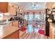 Bright kitchen features stainless appliances, light wood cabinets, and an adjacent breakfast nook at 233 Rialto Rd, Kissimmee, FL 34759