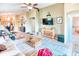 Open-concept living area with tile floors, modern furniture, and views into other rooms at 233 Rialto Rd, Kissimmee, FL 34759