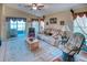 Cozy living room with vaulted ceiling, comfortable seating, and serene lake views at 233 Rialto Rd, Kissimmee, FL 34759