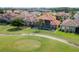 Aerial view of the backyard with a pool overlooking the golf course at 2333 Pinehurst Ct, Davenport, FL 33837