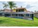 Exterior of a beautiful home featuring a large swimming pool, spa, and screened-in patio at 2333 Pinehurst Ct, Davenport, FL 33837