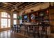 Stylish bar area with ample seating, a wide selection of beverages, and multiple TVs for entertainment at 2333 Pinehurst Ct, Davenport, FL 33837