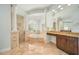Luxurious bathroom featuring a soaking tub with columns and a separate shower at 2333 Pinehurst Ct, Davenport, FL 33837