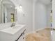 Bathroom showcasing a light-toned vanity with a stone countertop and sleek fixtures at 2333 Pinehurst Ct, Davenport, FL 33837