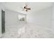 Clean bedroom with luxury vinyl tile flooring and a ceiling fan at 2333 Pinehurst Ct, Davenport, FL 33837