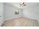 Bright bedroom with neutral walls, ceiling fan, and hardwood flooring at 2333 Pinehurst Ct, Davenport, FL 33837
