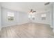 Expansive bedroom with light hardwood floors and abundant natural light from multiple windows at 2333 Pinehurst Ct, Davenport, FL 33837