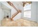 Open foyer featuring a wood staircase, travertine floors, and high ceilings with chandelier at 2333 Pinehurst Ct, Davenport, FL 33837