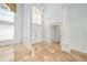 Bright foyer with high ceilings, tile floors, and a grand entrance at 2333 Pinehurst Ct, Davenport, FL 33837