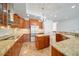 Bright kitchen featuring granite countertops, stainless appliances and tile floors at 2333 Pinehurst Ct, Davenport, FL 33837