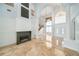 Bright living room featuring a fireplace, tall ceilings, and a marble floor at 2333 Pinehurst Ct, Davenport, FL 33837