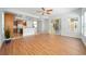 Open-concept living area featuring tile floors, a ceiling fan, and a view into the kitchen at 2333 Pinehurst Ct, Davenport, FL 33837